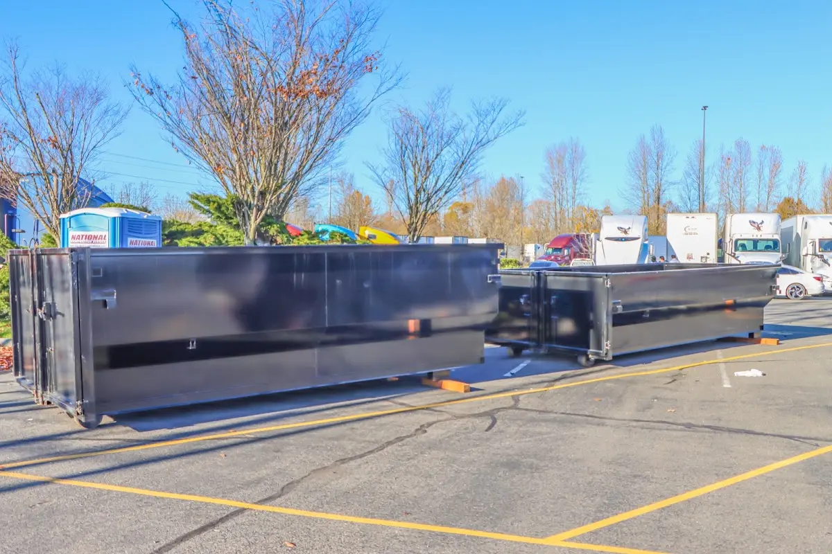 Professional dumpster rental service with roll-off container on residential driveway in Orangevale